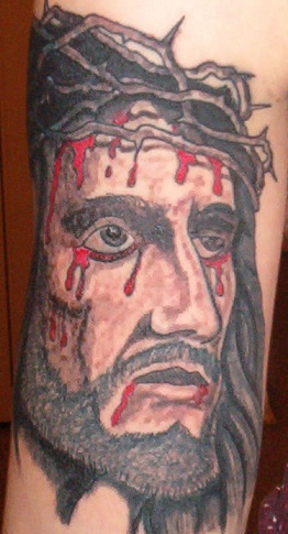 Jesus tatovering på underarmen