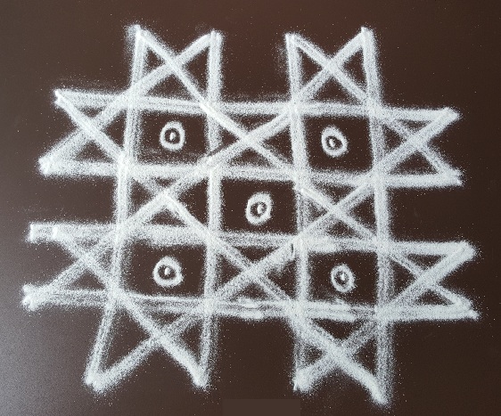 Star Kolam Design pöttyökkel