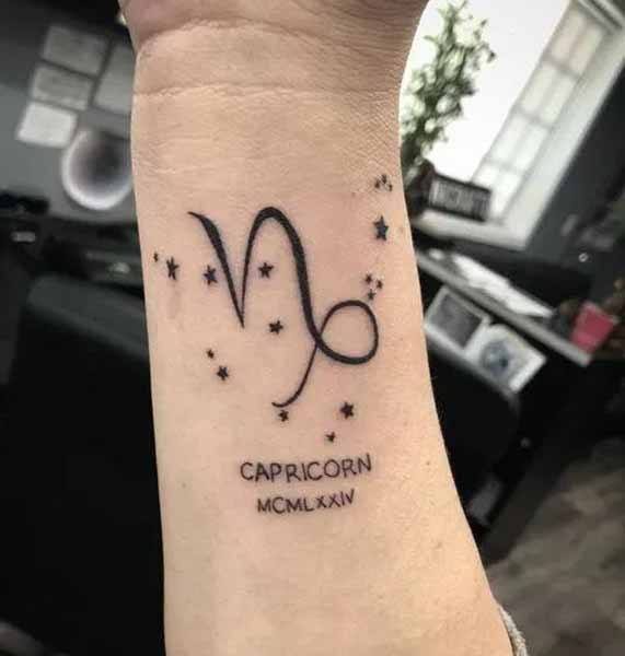 Cursive Small N Tattoo