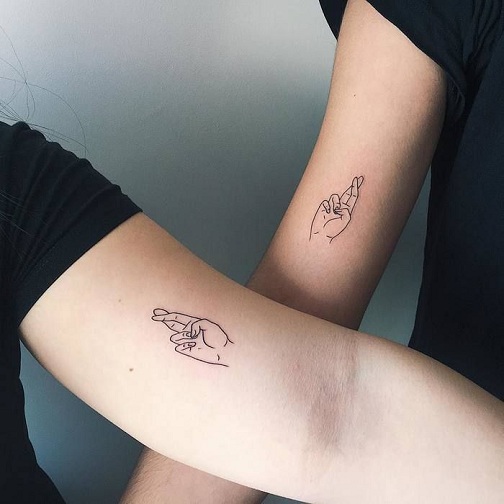 Matching Cross Finger Friend Tattoo