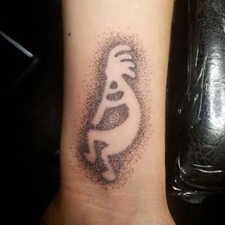 Prikarbejde Kokopelli tatovering