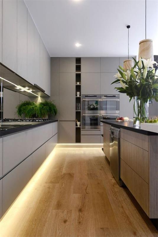 LED -taustavalo moderneissa keittiöissä korostaa sisätiloja vihreillä kasveilla
