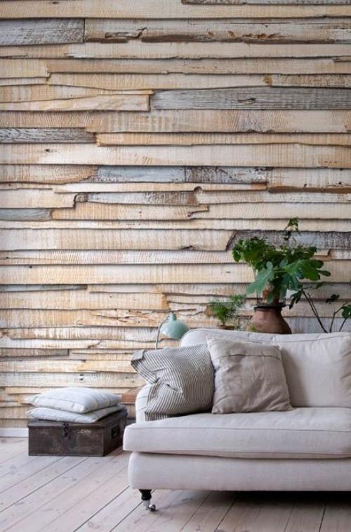 Korostusseinä moderni seinän suunnittelu beige harmaa puulaudat harmaa sohvatyynyt vihreä kasvi