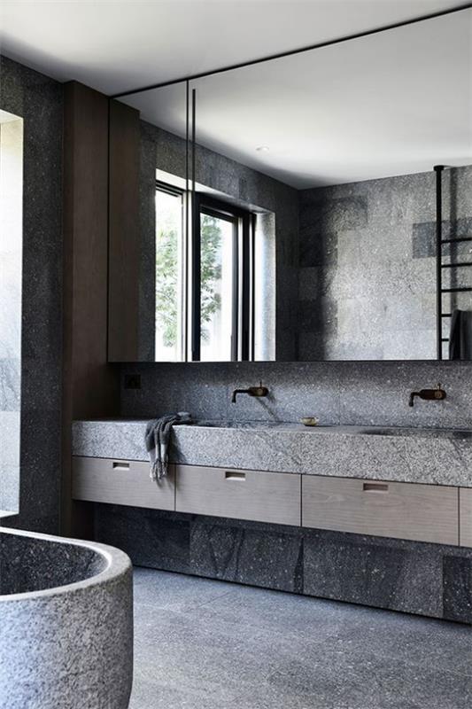Kylpyhuoneen mallit harmaa, karkea kivi, karkeat pinnat, harmaan eri sävyt, kaunis kylpyhuone