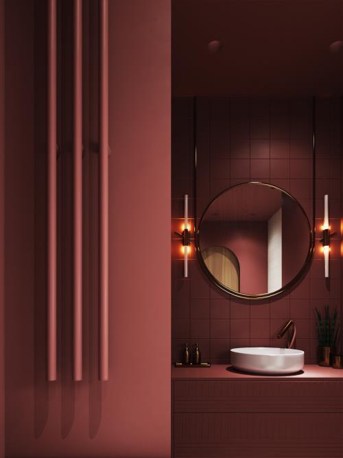 Kylpyhuone punaisessa kaunis, tyylikkäästi suunniteltu kylpyhuone pehmeällä punaisella sävyllä, pyöreä peili, seinävalaisimet, pyöreä valkoinen pesuallas