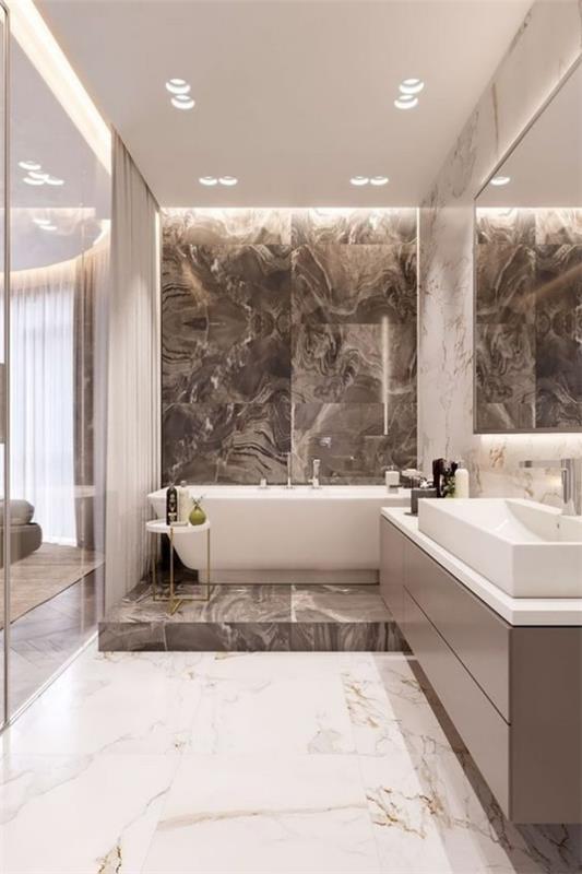 Ruskeat modernit kylpyhuoneen marmorilaatat hasselpähkinänruskealla ja valkoisella ylellisellä kylpyhuoneella
