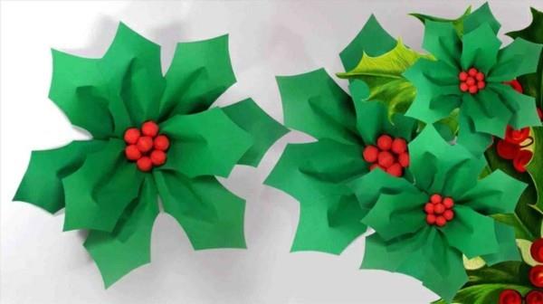 Tee vihreitä joulukukkia paperilla