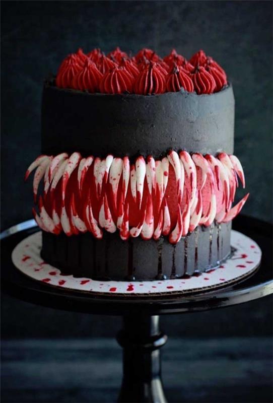 Halloween kakku - musta pyöreä kakku punaisella koristeella