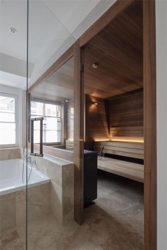 Kotisauna tilava kylpyhuonetila saunalle kotona lasiseinän takana ensiluokkaista muotoilua