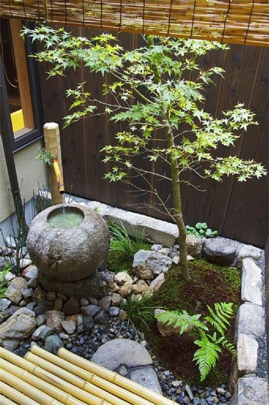 Japanilainen puutarha korkea esteettinen visuaalinen harmonia kivet sora kivi suihkulähde matala kasvaa pensaat puu bambu