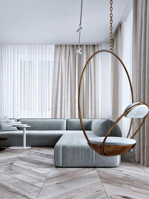 Minimalismi olohuoneessa, täydellinen muotoilu, huonekalut, roikkuva tuoli etualalla