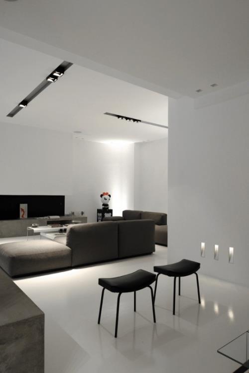 Minimalismi olohuoneessa täydellinen huoneen suunnittelu sisäänrakennetut valot tyypillinen huoneen valaistus