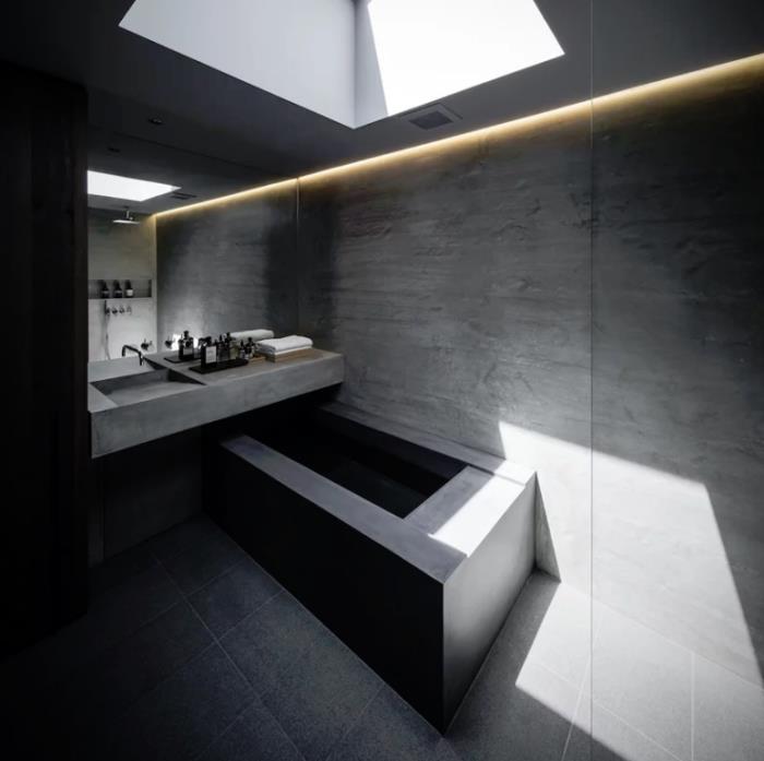 Minimalistinen kivi- ja betonitalo Japanissa Puhdasta minimalismia sisätilojen kylpyhuoneessa erittäin minimalistinen kylpyamme betonista sisäänrakennetuista LED-valoista