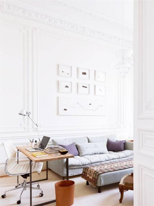 Pariisin tyylikäs olohuoneessa, valoisa tunnelma, henkilökohtaiset työalueen seinämaalaukset