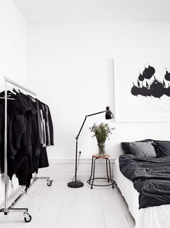 Sisusta makuuhuone minimalistisella tavalla. Lattiavalaisin sängyn vieressä, täydellinen valaistusidea