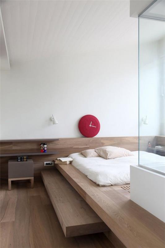 Makuuhuoneen minimalistinen sisustus vaalea puu yksinkertainen muotoilu makuuvuode