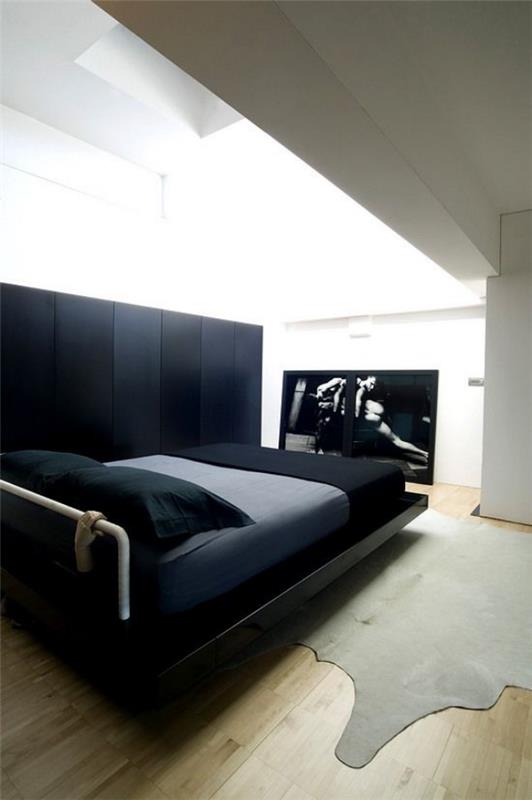 Sisusta makuuhuoneen minimalistinen musta sänky tuomaan ylellisyyttä