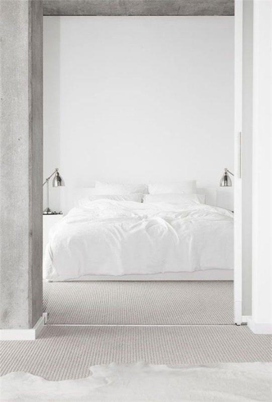 Minimalistinen makuuhuone asetti valkoisen pellavan betoniseinän etualan ovikehykseen
