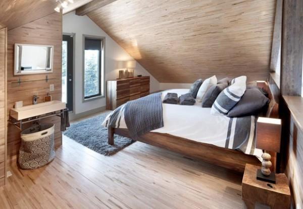 Makuuhuone viistot lämpimät värit beige paljon puuta Kanadan unelma taloja