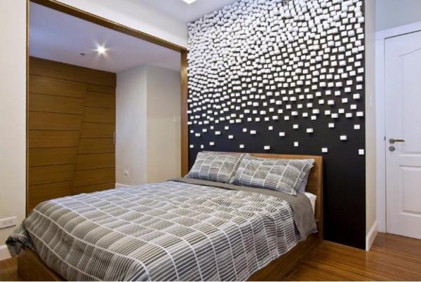 Musta seinä moderni makuuhuone aksentti seinä valkoisilla koristeilla paljon puuta huoneessa visuaalinen korvaus