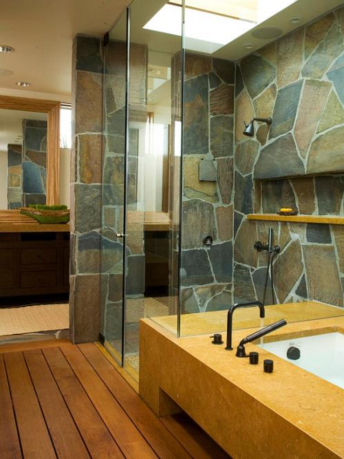 Kivi kylpyhuoneessa, kivilaatat seinillä, puulattia, lasinen suihkukaappi, moderni kylpyhuone