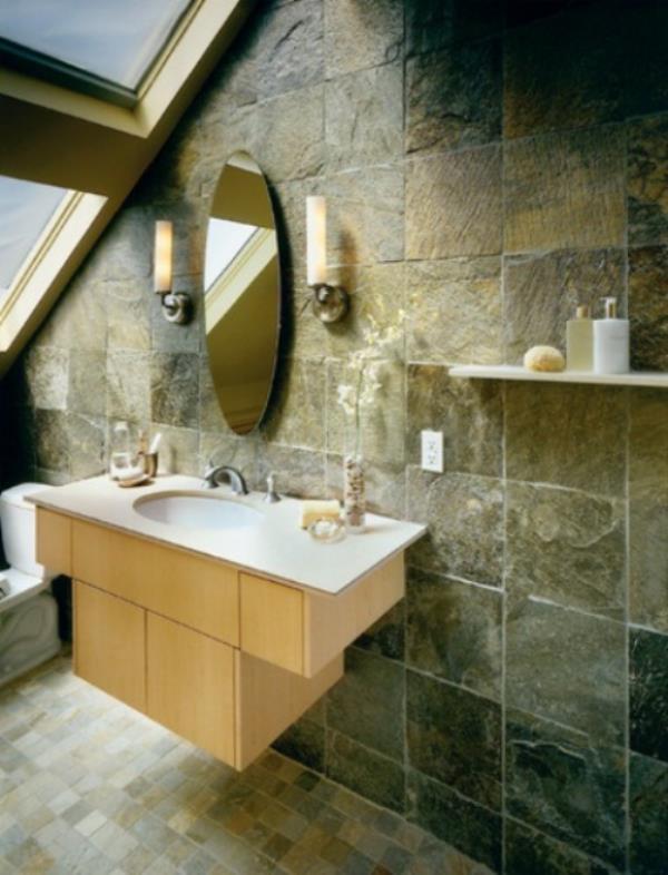 Kivi kylpyhuoneessa väreillä ja tekstuureilla on pyöreä peili