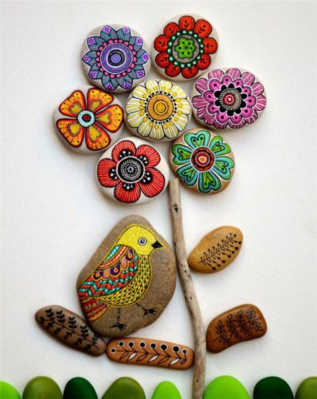 Kivien maalaaminen värillisillä kukilla, käsitöitä kivillä