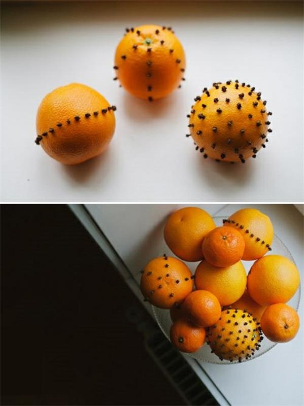 Joulukoristeet tekevät appelsiinit, joissa on neilikan silmut kulhoon