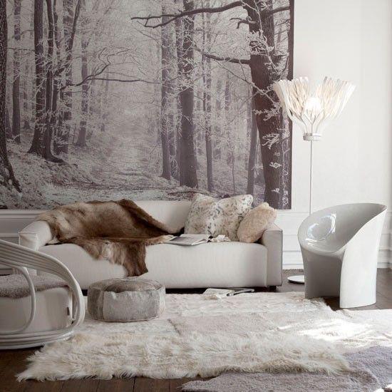 Talvikoriste olohuoneessa Lumivalkoiset pehmoiset tekstuurit vaaleissa väreissä Lumimaisema seinällä kodikas tunnelma erittäin kutsuva
