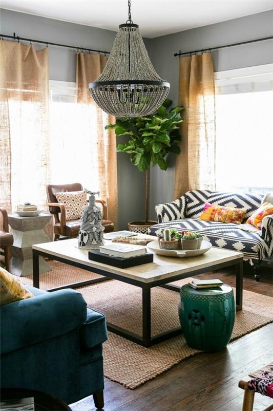 Kodin tarvikkeet modernissa olohuoneessa koristekappaleita persoonallisia vihreitä huonekasvityynyjä