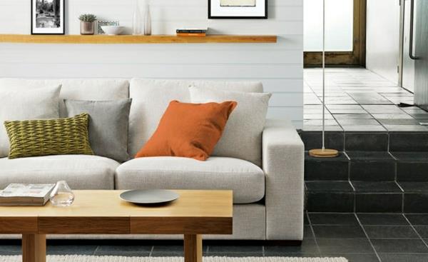 Olohuoneen sohvapöydän väriehdotukset oranssit tyynyt
