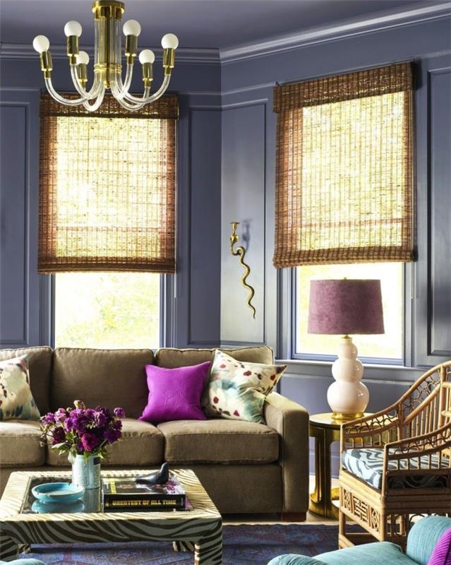 Olohuoneissa yhdistyvät pajuiset nojatuolit, ikkunaluukut ja pienet kirkkaat värit violetilla
