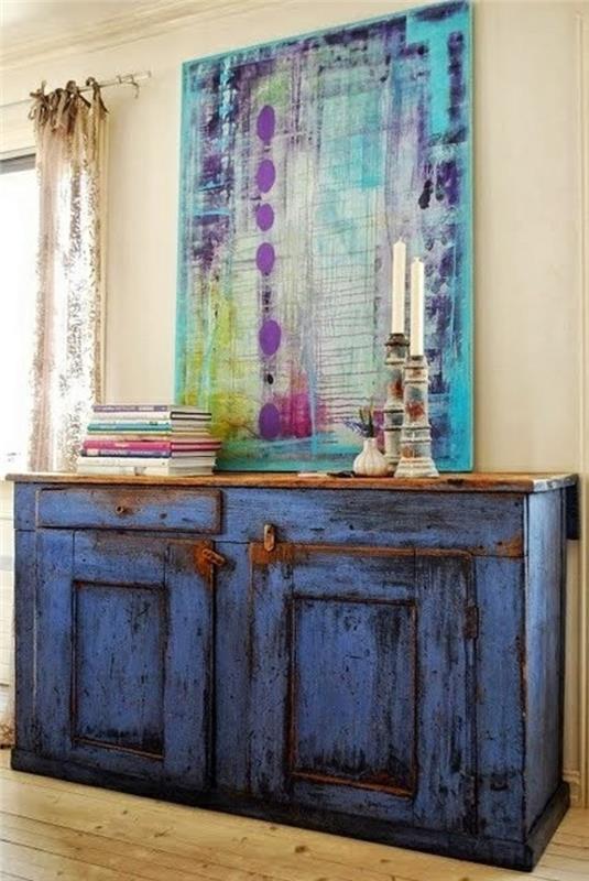 sideboard koristella vintage lipasto sininen sideboard kirjoja kynttilänjalka