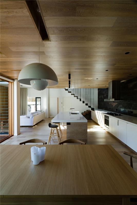 arkkitehtitalo moderni sisustus puu keittiö ruokailuhuone puinen pöytä