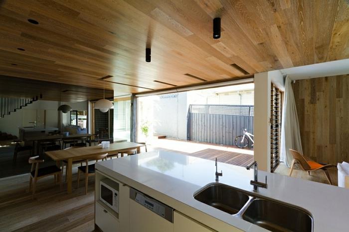 arkkitehtitalo moderni sisustus puu keittiö ruokailuhuone