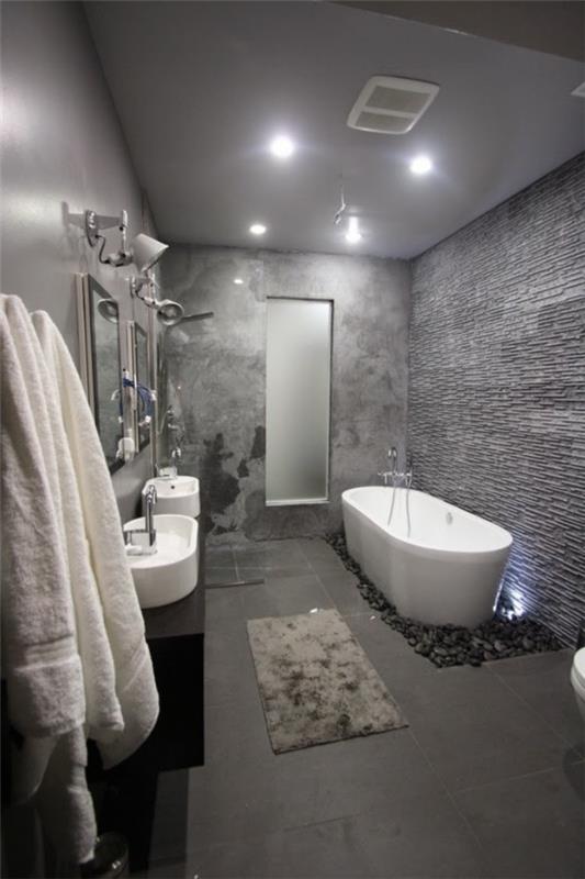 kylpyhuone harmaa valkoinen kylpyamme kiviä