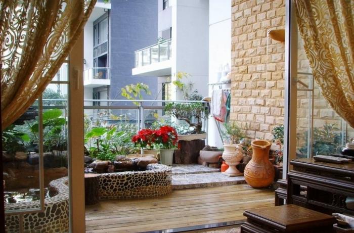 parveke-deco-ideoita-lampi-kivet-puulattiat