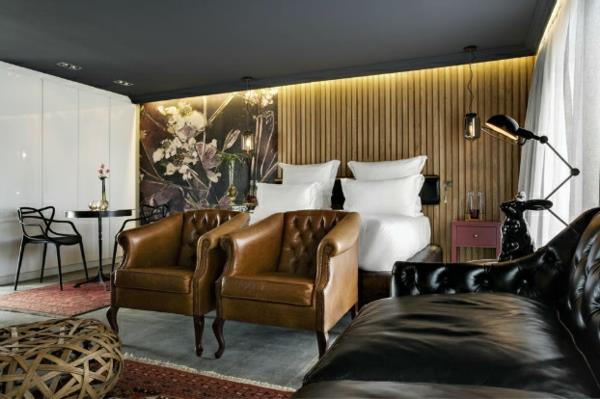 ruskea nahkainen nojatuoli hotellihuone sohva musta houkutteleva ylellinen