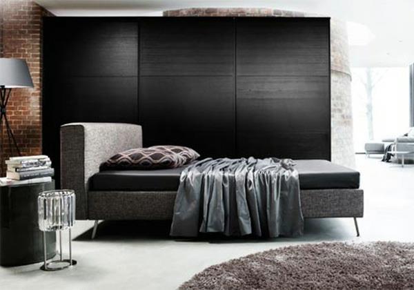 ruskea tiiliseinä mustat seinät suunnitteluidea makuuhuone