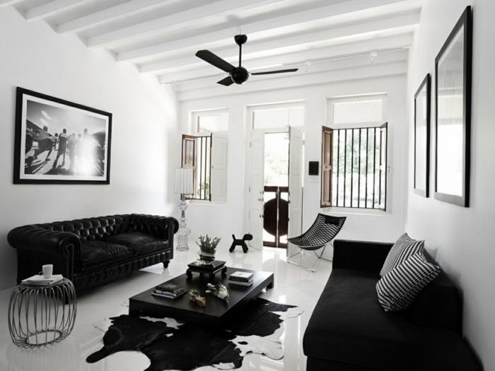chesterfield -sohva musta turkismatto valkoiset seinät