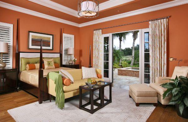 viileä makuuhuoneen värimaailma korostaa oransseja seiniä