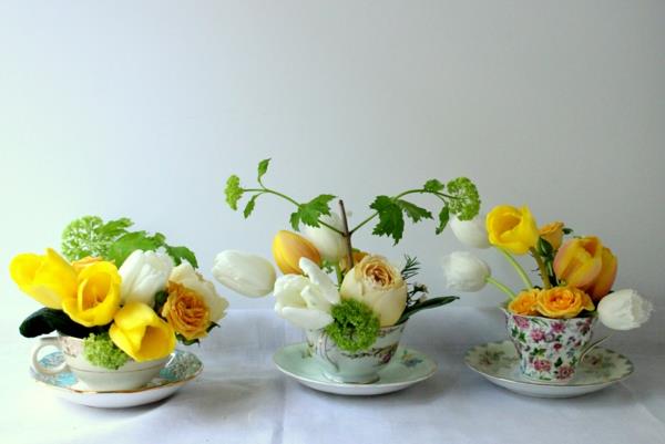 sisustusideoita asunnon pöytäkoristeet kevään kukat teekupit