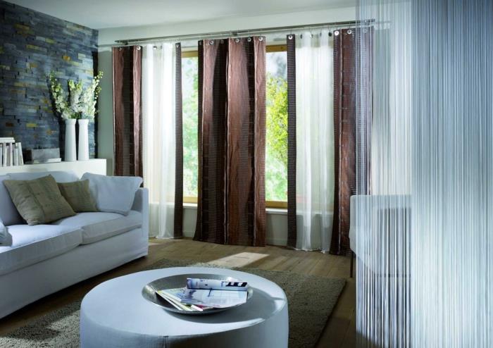 sisustusvinkkejä ikkunalauta olohuone matto pyöreä jakkara kiviseinä valkoiset huonekalut