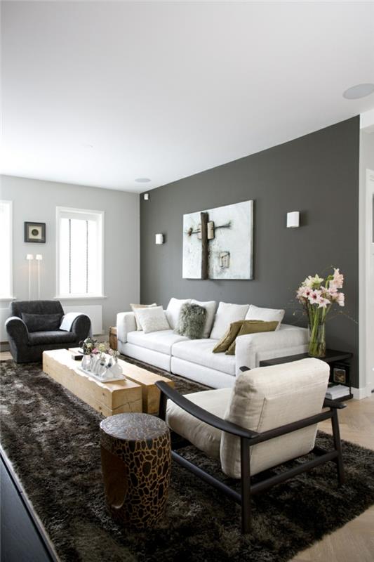 sisustusideoita olohuone harmaa aksentti seinä turkis matto valkoiset huonekalut maalaismainen sohvapöytä