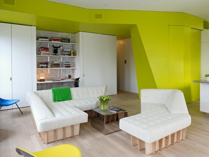 Kalustettu yhden huoneen huoneisto parvihuoneisto olohuone sohva sohva valkoiset puukalusteet neonvihreät seinät