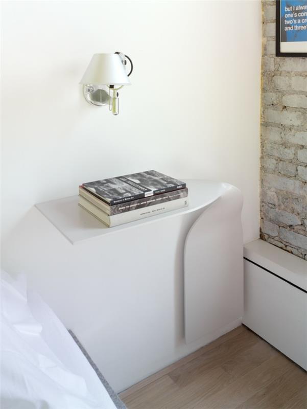 yhden huoneen huoneisto pystytetty seinävalaisin yöpöytä moderni muotoilu tiiliseinä