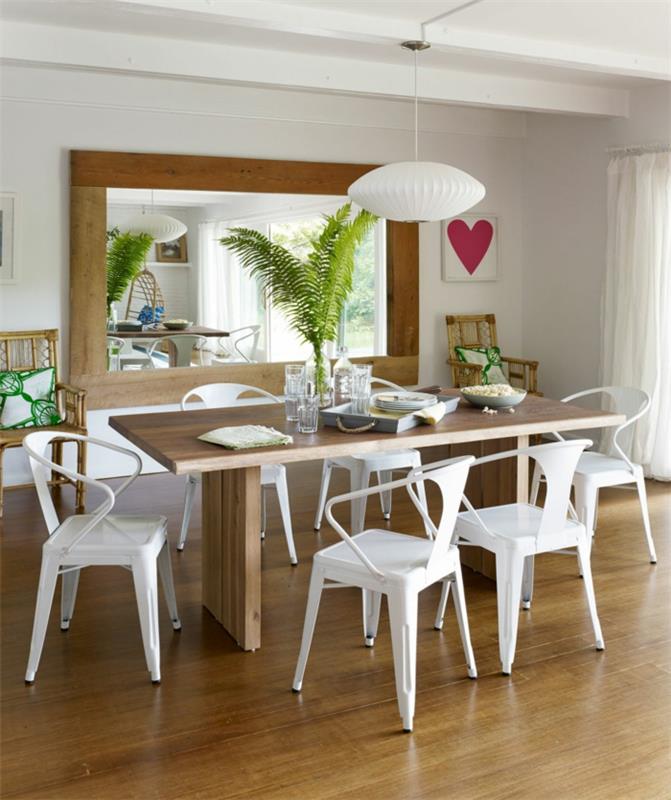 ruokasalin koristelu maalaismainen ruokapöytä valkoiset tuolit seinäpeilikasvit