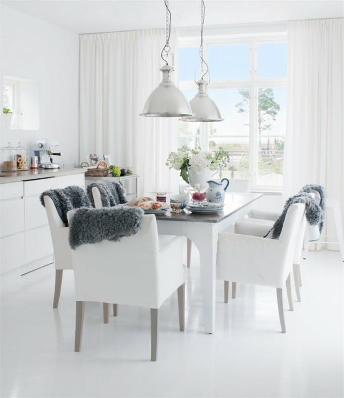 ruokasali moderni skandinaavinen tyyli valkoisilla tuoleilla ja mukava sisustus