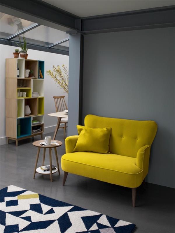 kevään värit keltainen sohva harmaa seinä geometrinen matto