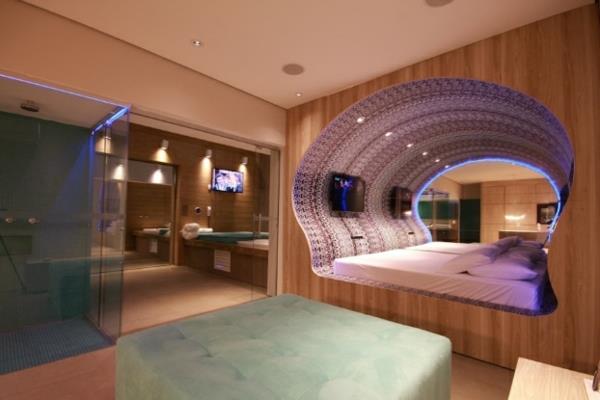 futuristinen makuuhuone suunnittelee kuoren muotoista neonvaloa
